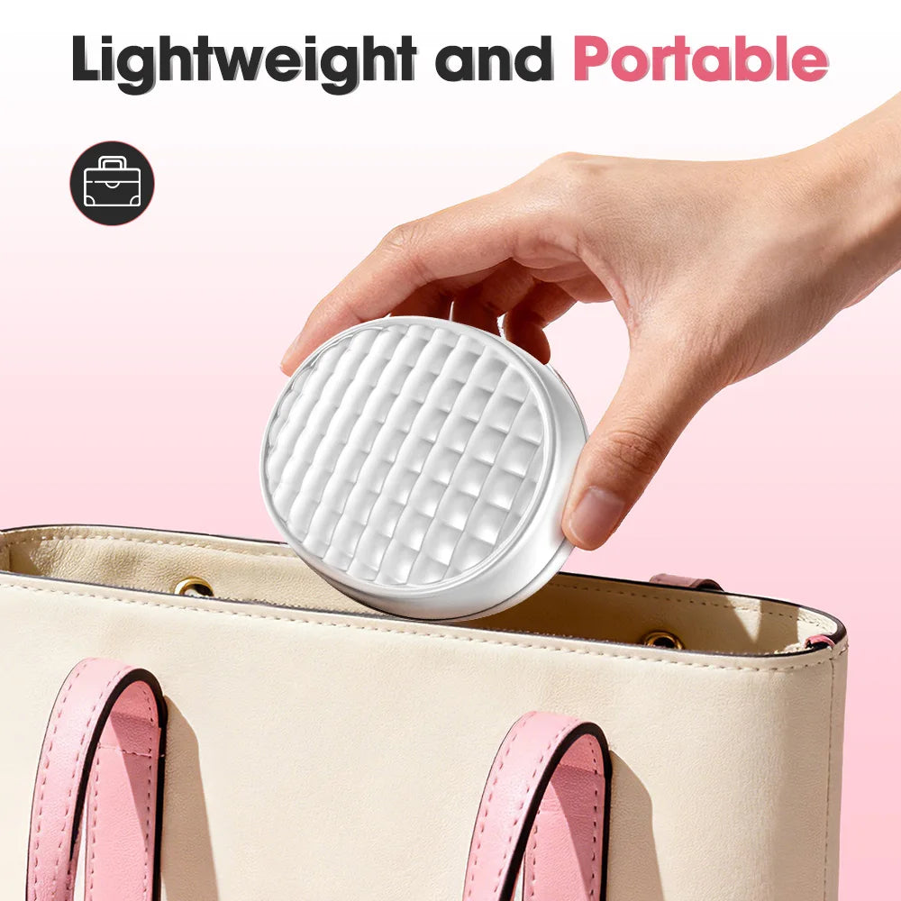 Hand placing compact, white textured skin care device into beige handbag, lightweight and portable