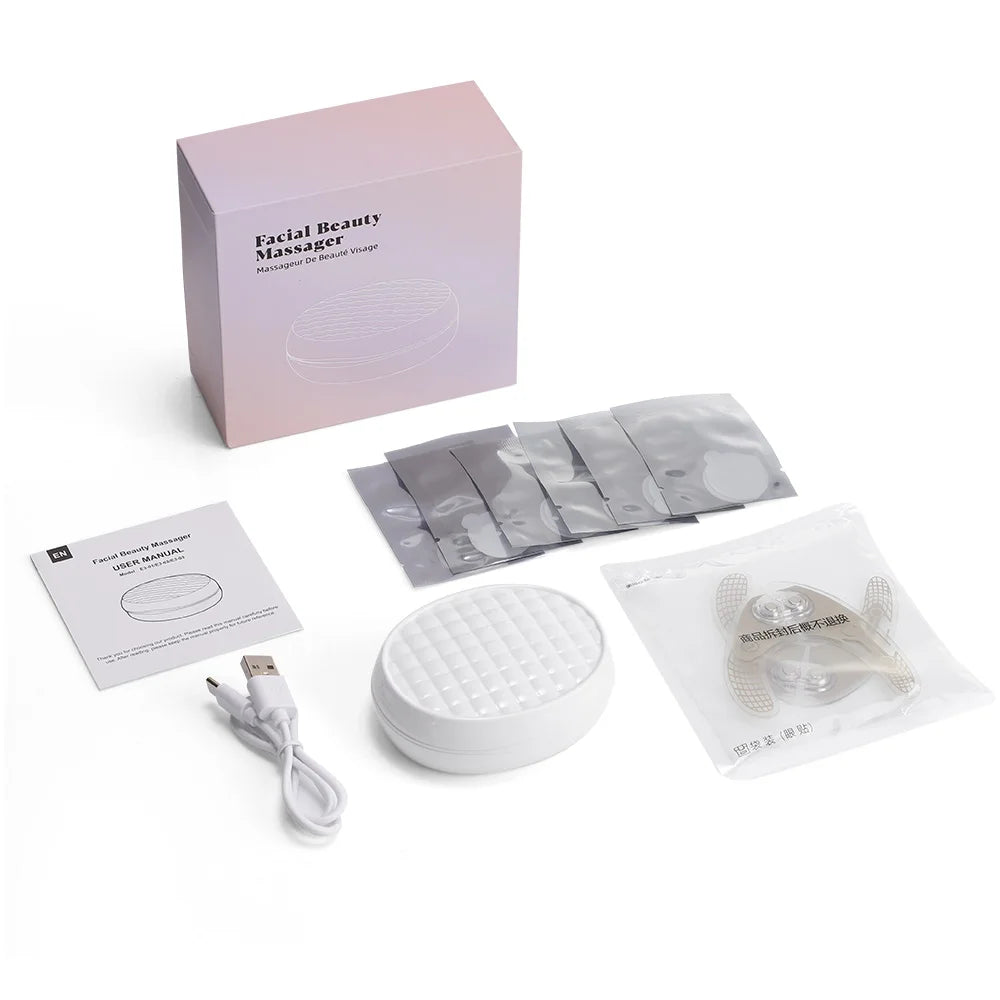 Facial beauty massager kit with device, USB cable, adhesive pads, user manual, and packaging.